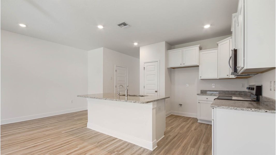 Furnished interior view inside a new home in Bayside at Ward Creek, Panama City Beach (Image 9).