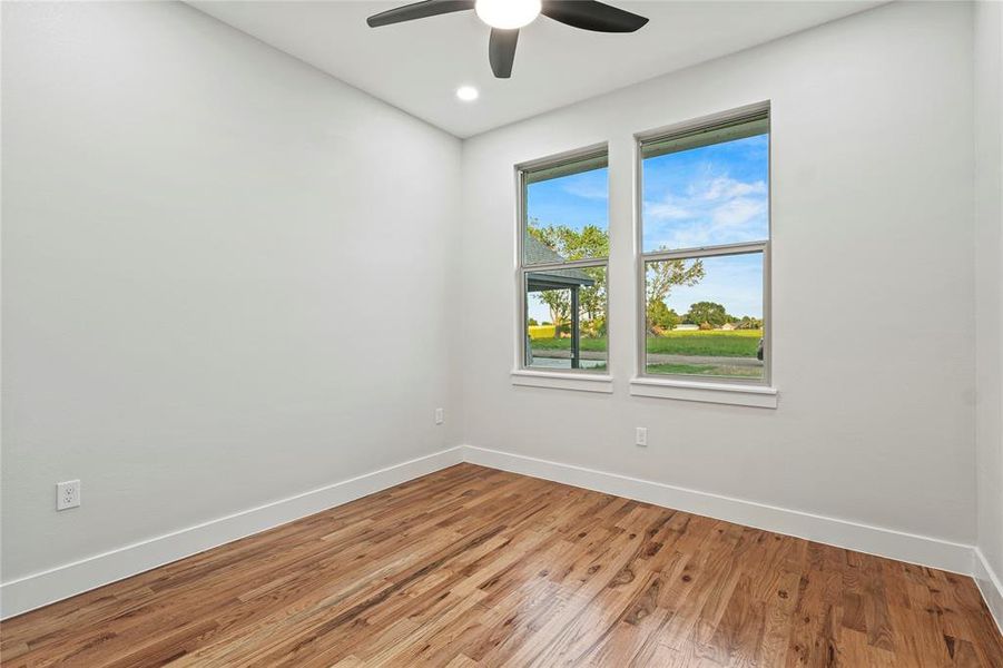 Unfurnished room featuring a ceiling fan, light wood-style flooring, and recessed lighting Unfurnished room featuring a ceiling fan, light wood-style flooring, and recessed lighting