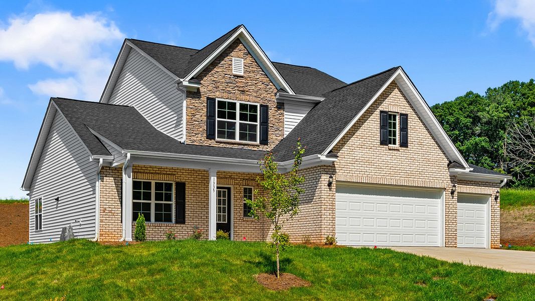 Front exterior of a new home in Brooke Hill, Lewisville, NC, highlighting curb appeal (Image 2). Front exterior of a new home in Brooke Hill, Lewisville, NC, highlighting curb appeal (Image 2).