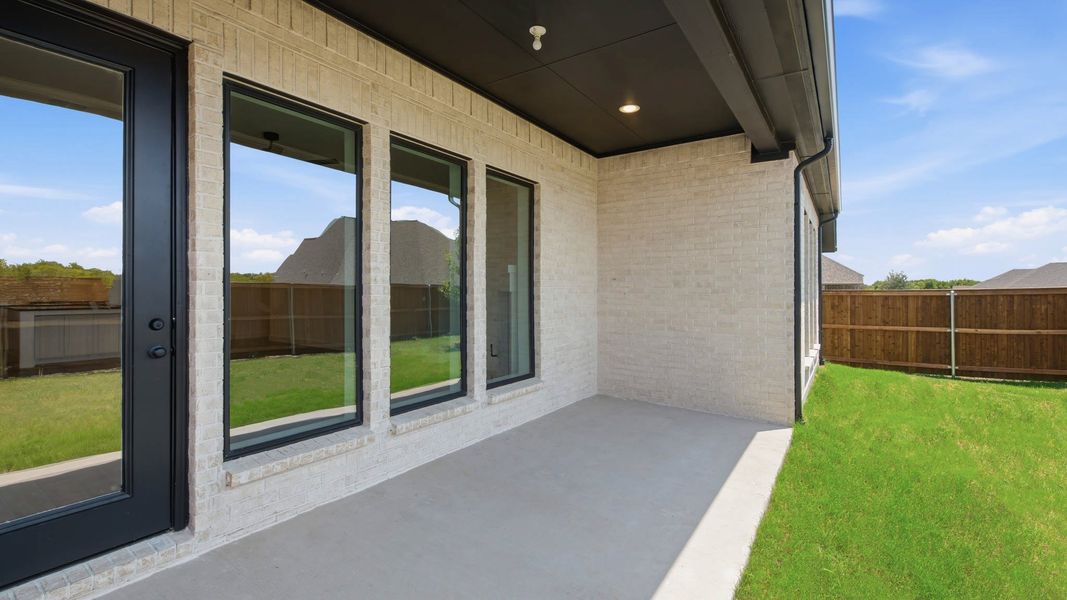 Exterior details and patio area of a home in Mustang Lakes, Celina (Image 3).