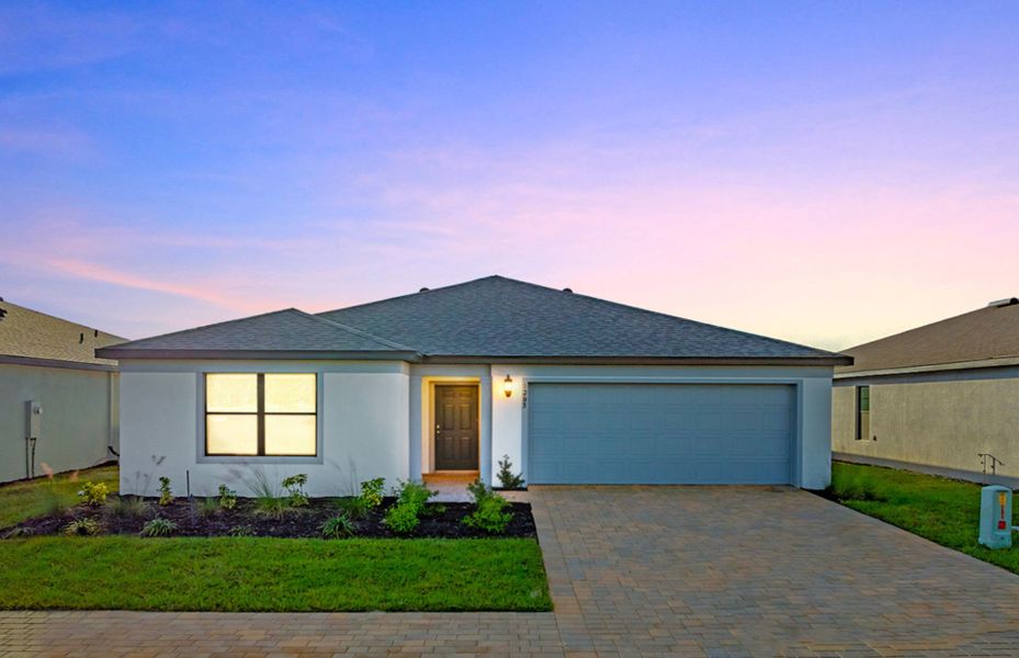 Front exterior of a new home in Caloosa Cove, Labelle, FL, highlighting curb appeal (Image 2).