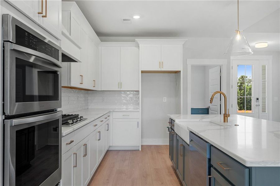 Culinary delights await in this bright kitchen wit Culinary delights await in this bright kitchen wit