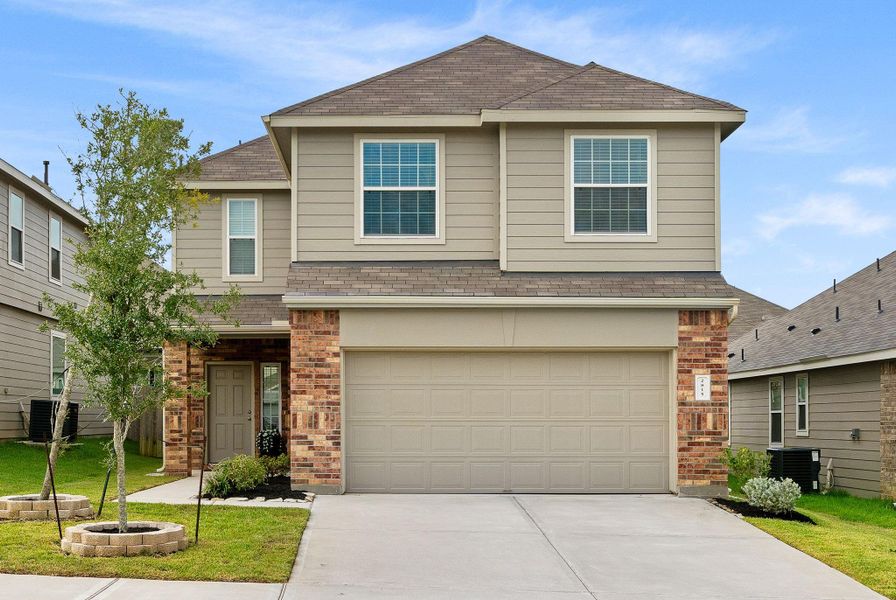 Front exterior of a new home in Madison Bend, Conroe, TX, highlighting curb appeal (Image 23). Front exterior of a new home in Madison Bend, Conroe, TX, highlighting curb appeal (Image 23).
