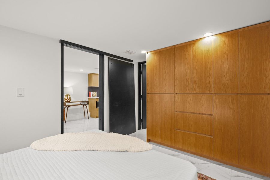 Bedroom featuring recessed lighting and a closet