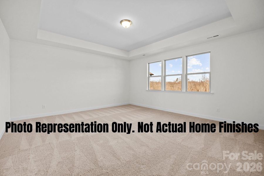 Primary Bedroom With Tray Ceiling