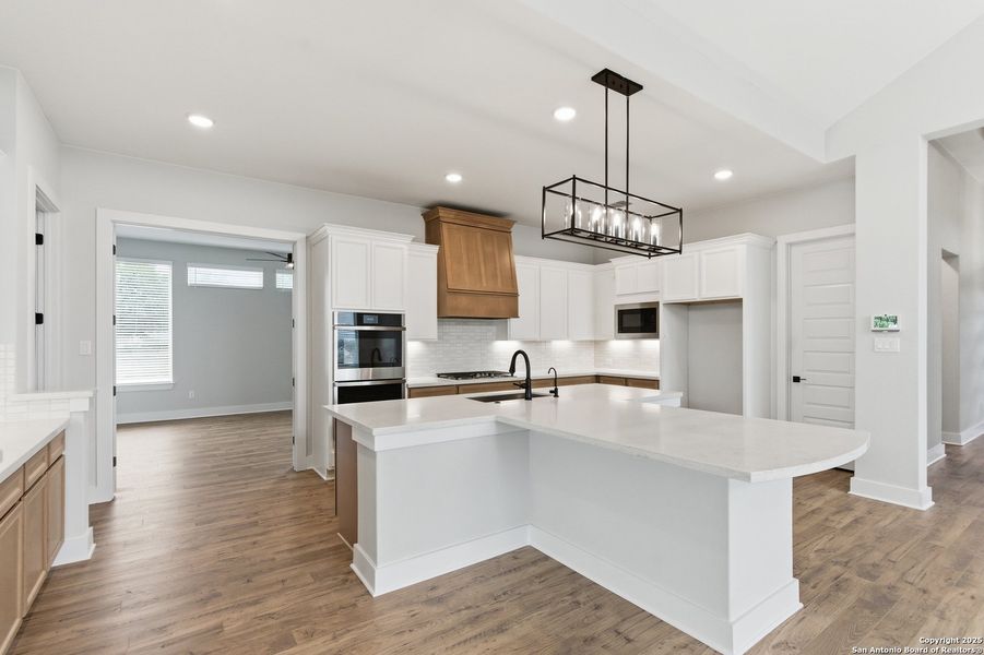 Furnished interior view inside a new home in Potranco Oaks, Castroville (Image 10).