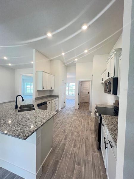 Furnished interior view inside a new home in Hill Country Estates, Dade City (Image 9).