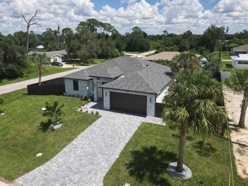 Front exterior of a new home in , Port Charlotte, FL, highlighting curb appeal (Image 25).