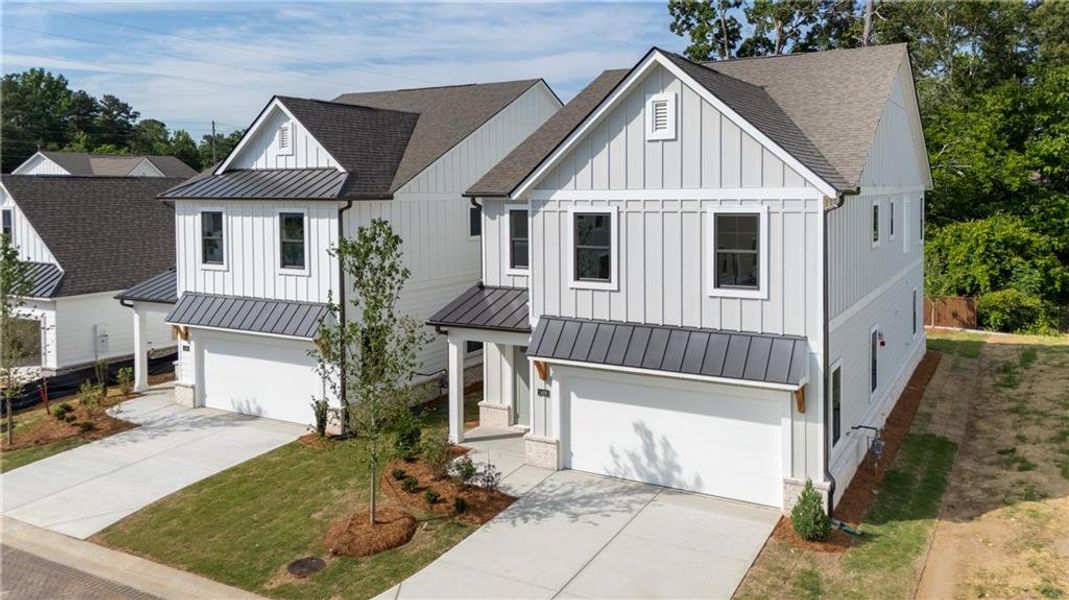 Front exterior of a new home in The Village at Sandy Plains, Marietta, GA, highlighting curb appeal (Image 2). Front exterior of a new home in The Village at Sandy Plains, Marietta, GA, highlighting curb appeal (Image 2).