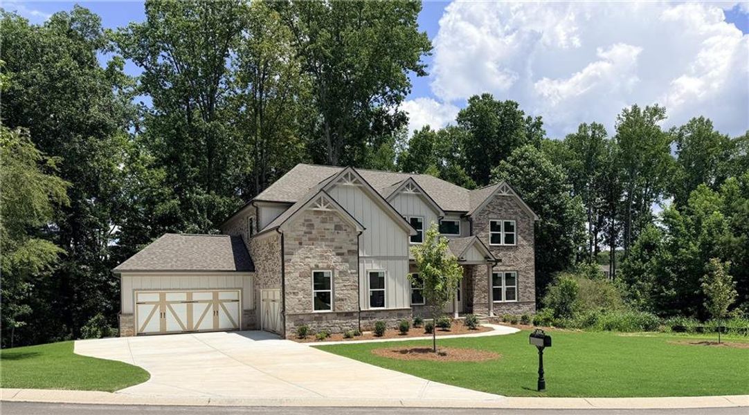 Front exterior of a new home in Sierra Lake, Cumming, GA, highlighting curb appeal (Image 1). Front exterior of a new home in Sierra Lake, Cumming, GA, highlighting curb appeal (Image 1).