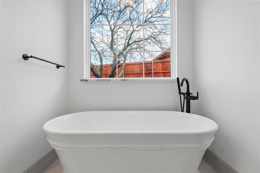 Bathroom with a tub to relax in