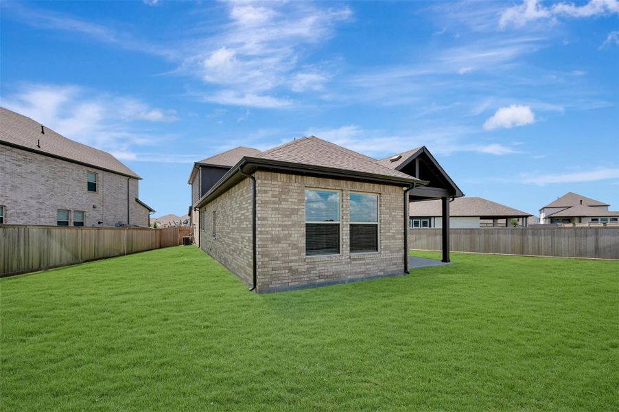 Exterior details and patio area of a home in Prairieland Village - Grove Collection, Cypress (Image 4). Exterior details and patio area of a home in Prairieland Village - Grove Collection, Cypress (Image 4).