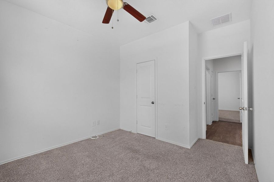 Soft carpeting underfoot defines this versatile secondary bedroom space. Soft carpeting underfoot defines this versatile secondary bedroom space.