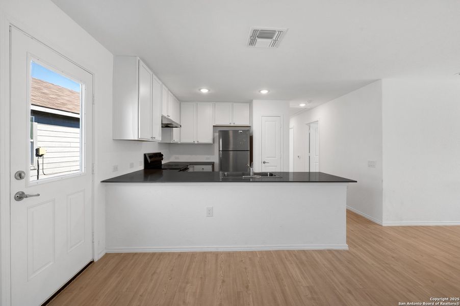 Furnished interior view inside a new home in , San Antonio (Image 7).