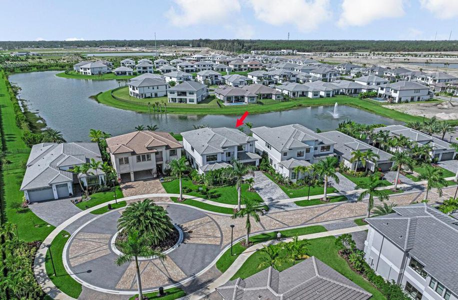 Front exterior of a new home in Apex at Avenir, Palm Beach Gardens, FL, highlighting curb appeal (Image 27).