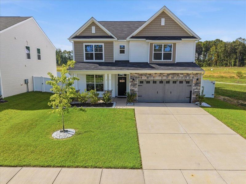 Front exterior of a new home in , Ridgeville, SC, highlighting curb appeal (Image 28). Front exterior of a new home in , Ridgeville, SC, highlighting curb appeal (Image 28).