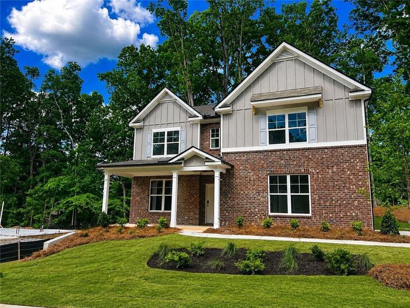 Front exterior of a new home in Cascade Ridge at Niskey Lake, Atlanta, GA, highlighting curb appeal (Image 2). Front exterior of a new home in Cascade Ridge at Niskey Lake, Atlanta, GA, highlighting curb appeal (Image 2).