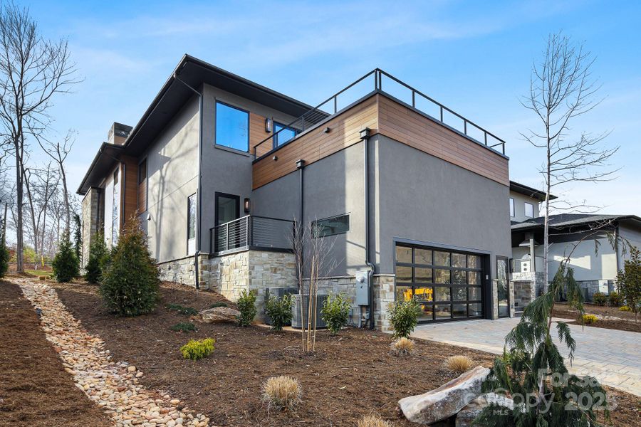 Front exterior of a new home in , Arden, NC, highlighting curb appeal (Image 1).