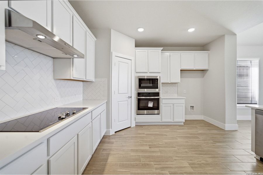Furnished interior view inside a new home in The Woodlands at Medina Hills, Mico (Image 8).