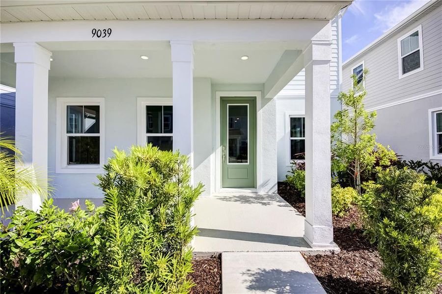 Exterior details and patio area of a home in Bungalow Walk at Lakewood Ranch, Sarasota (Image 3).