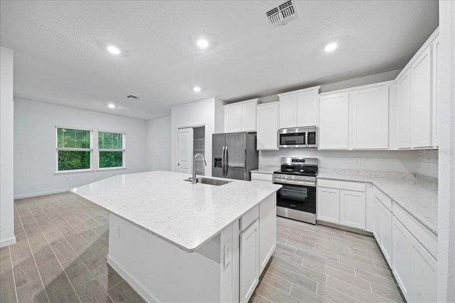 Furnished interior view inside a new home in Grand Park North, Dunnellon (Image 13).