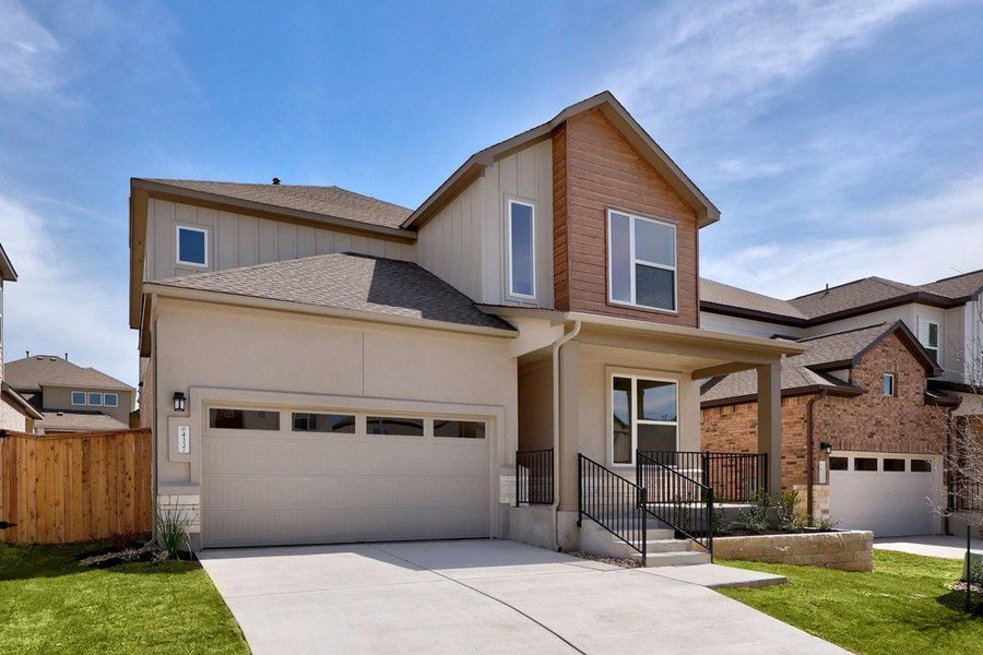 Front exterior of a new home in University Heights, Round Rock, TX, highlighting curb appeal (Image 22).