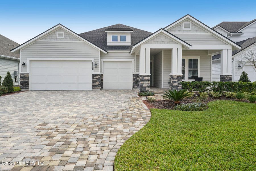 Front exterior of a new home in Middlebourne, St. Johns, FL, highlighting curb appeal (Image 28).