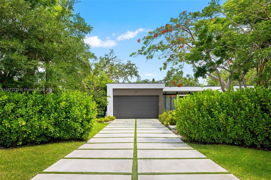 Front exterior of a new home in , Pinecrest, FL, highlighting curb appeal (Image 20).