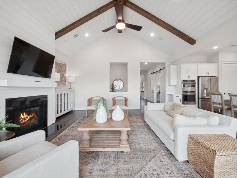 Great room with vaulted ceiling and stained ceiling beams Great room with vaulted ceiling and stained ceiling beams