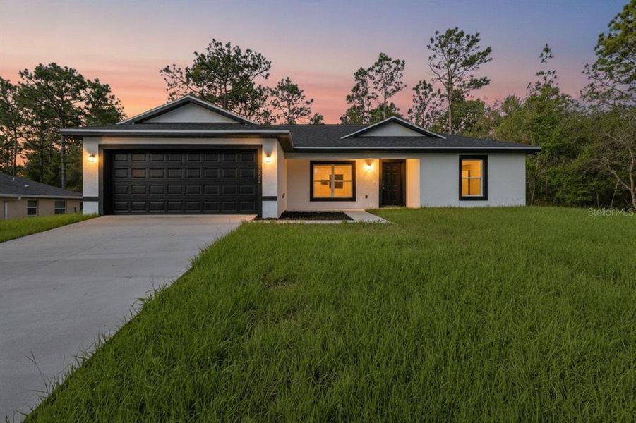 Front exterior of a new home in , Citrus Springs, FL, highlighting curb appeal (Image 20).