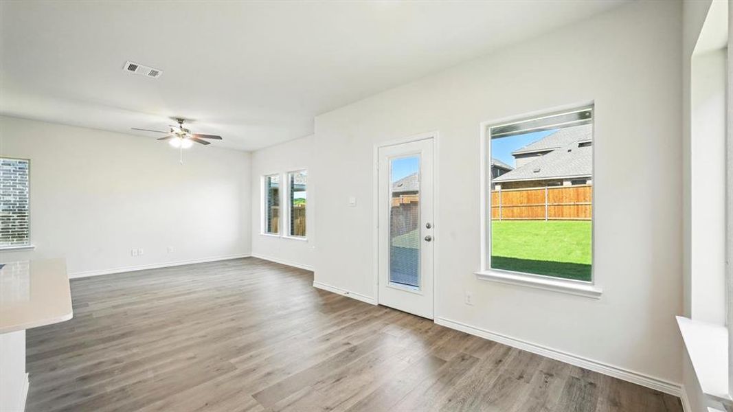 Unfurnished room with wood finished floors and ceiling fan