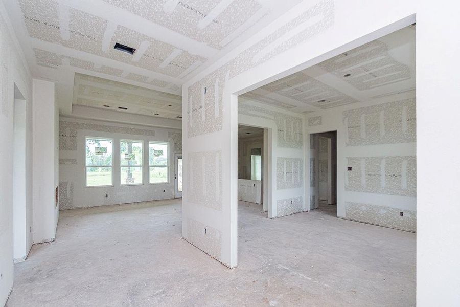Spacious unfinished interior with large windows offering ample natural light, featuring open-concept design and high ceilings, perfect for customization. Spacious unfinished interior with large windows offering ample natural light, featuring open-concept design and high ceilings, perfect for customization.