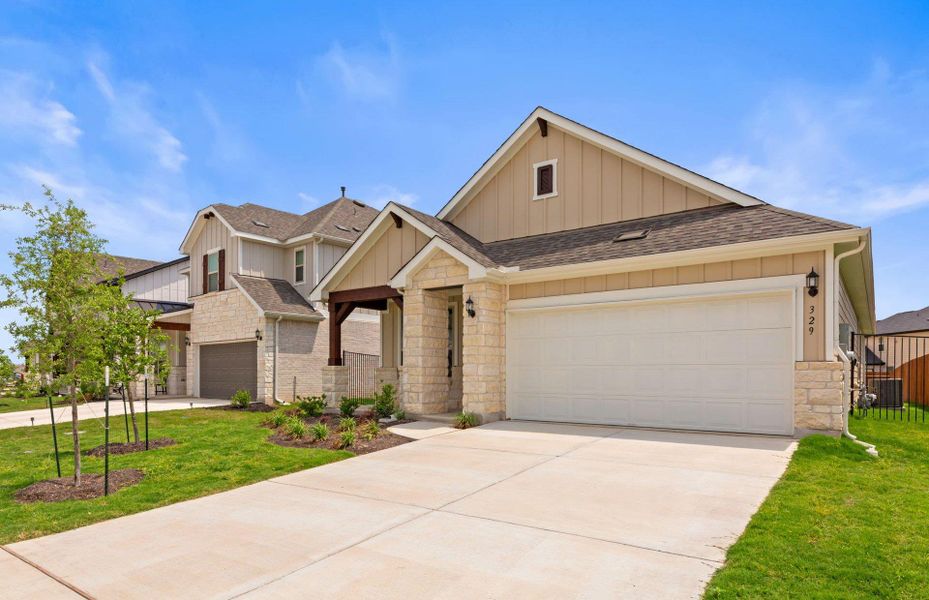 Front exterior of a new home in Santa Rita Ranch, Liberty Hill, TX, highlighting curb appeal (Image 2).