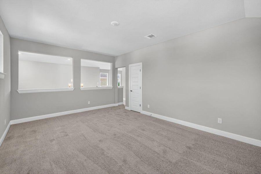 Empty room featuring carpet floors and baseboards Empty room featuring carpet floors and baseboards