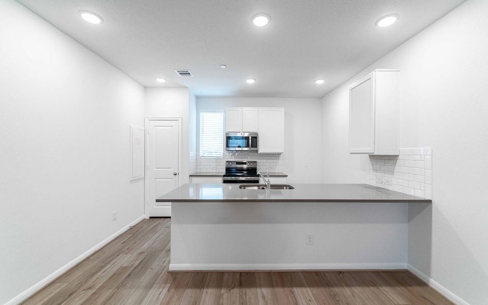 Furnished interior view inside a new home in Municipal Drive Townhomes, Leander (Image 3). Furnished interior view inside a new home in Municipal Drive Townhomes, Leander (Image 3).