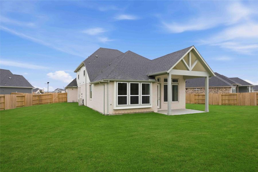 Exterior details and patio area of a home in Ellwood, Iowa Colony (Image 3).