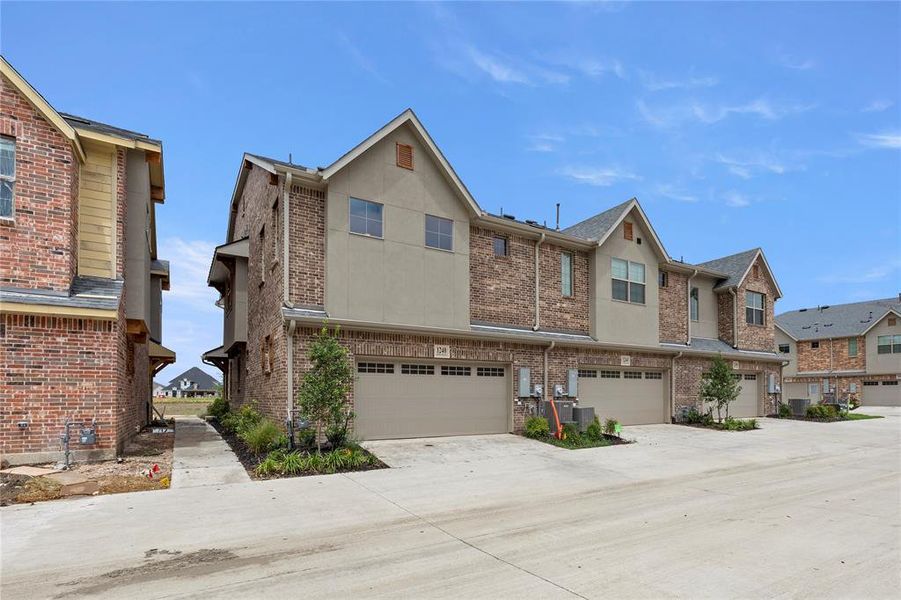Front exterior of a new home in The Tribute, The Colony, TX, highlighting curb appeal (Image 2). Front exterior of a new home in The Tribute, The Colony, TX, highlighting curb appeal (Image 2).