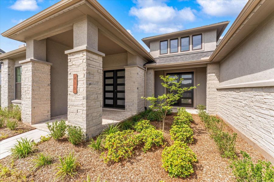 Situated on a quiet cul-de-sac, this beautifully designed Drees Homes property welcomes you with a sophisticated neutral exterior, oversized driveway, and expansive three-car garage.