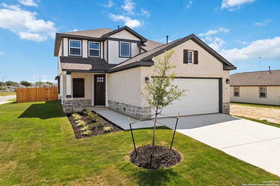 Front exterior of a new home in Hickory Ridge, Elmendorf, TX, highlighting curb appeal (Image 21).