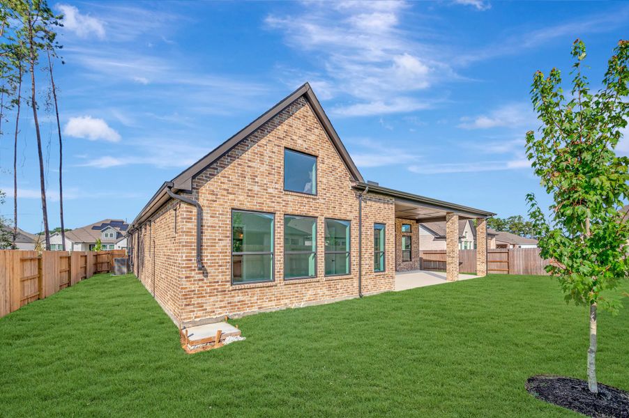Exterior details and patio area of a home in ARTAVIA - Parkview Collection, Conroe (Image 28).
