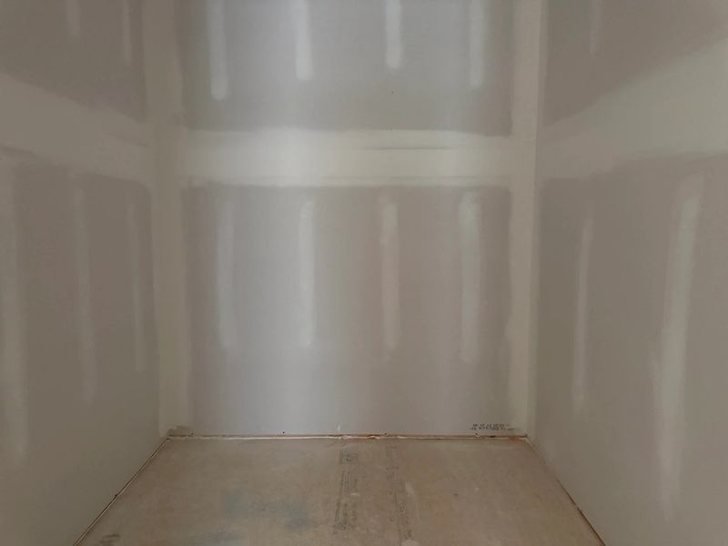 Primary Walk-In featuring the AW Collection® Coastal - Wire shelving adds clean, easy storage.