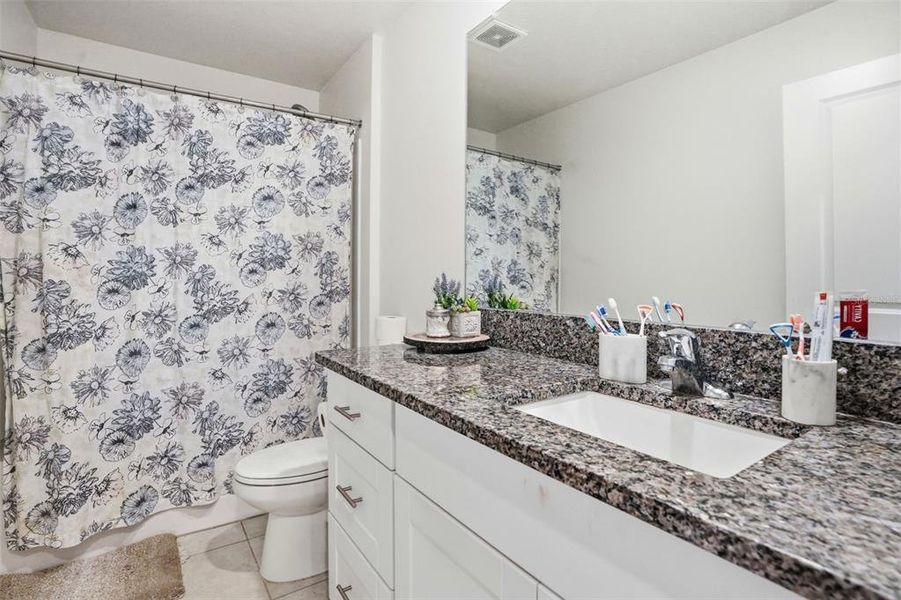 Furnished interior view inside a new home in The Isle of Avalon, Spring Hill (Image 8).