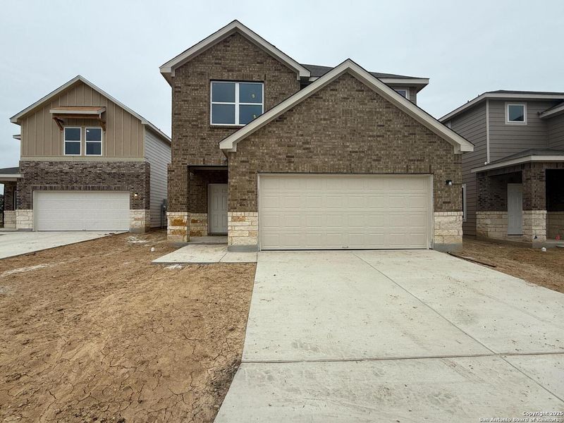 Front exterior of a new home in Meadows at Hennersby Hollow 40's, San Antonio, TX, highlighting curb appeal (Image 1).