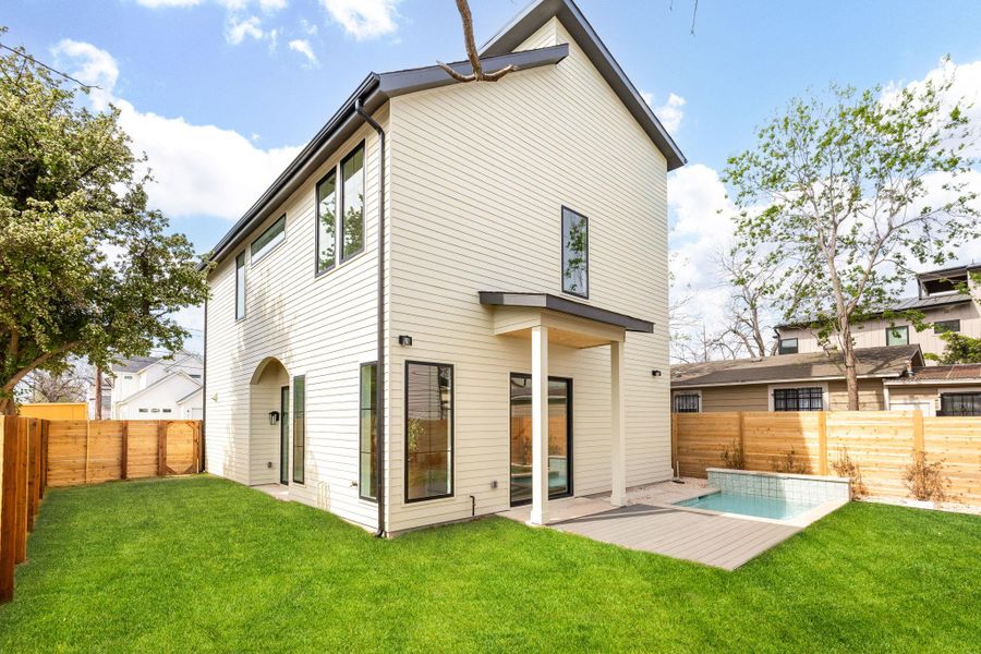 Rear view of property with a fenced backyard and a deck Rear view of property with a fenced backyard and a deck