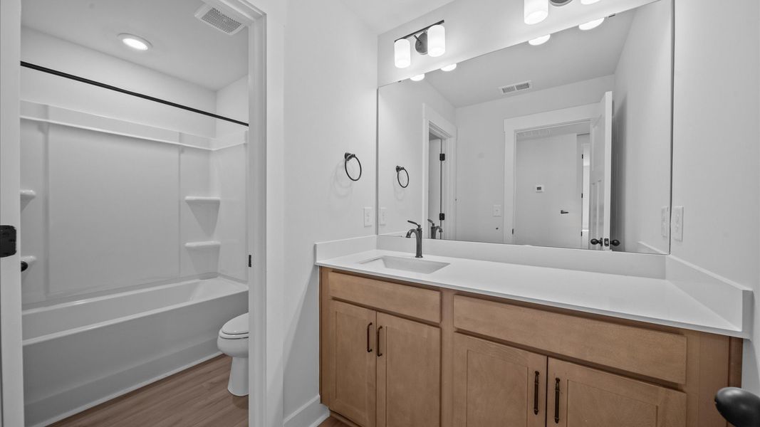 Notable full bathroom offering tasteful details and a bright, functional space