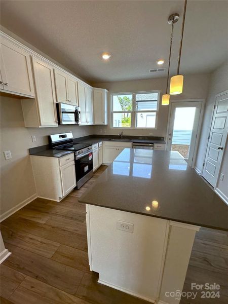 Digital Similar Image- Gourmet kitchen with 42" cabinets and Quartz Countertop and a large kitchen island.