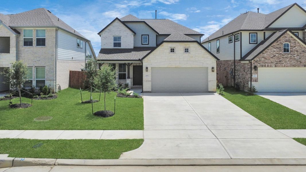 Home features a convenient 2-car garage complemented by a spacious driveway, offering ample parking for you and your guests. Home features a convenient 2-car garage complemented by a spacious driveway, offering ample parking for you and your guests.