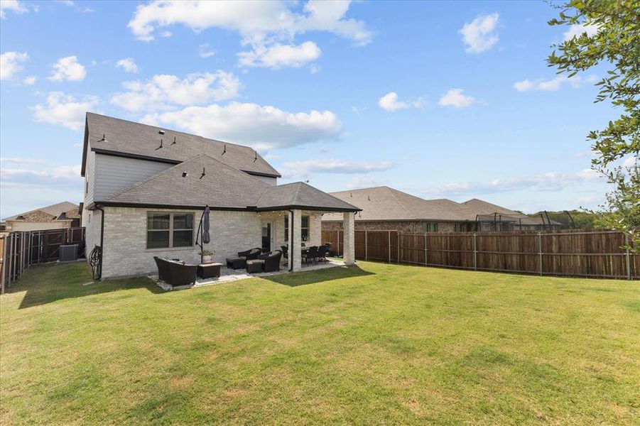 Exterior details and patio area of a home in DeBerry Reserve, Royse City (Image 4). Exterior details and patio area of a home in DeBerry Reserve, Royse City (Image 4).