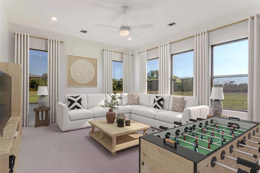 Living room featuring light colored carpet, recessed lighting, and a ceiling fan Living room featuring light colored carpet, recessed lighting, and a ceiling fan