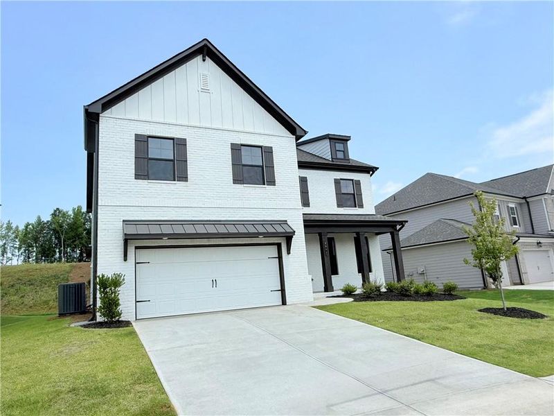Front exterior of a new home in Ponderosa Farms Manor, Gainesville, GA, highlighting curb appeal (Image 24).